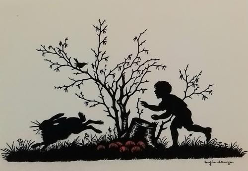Halloween scene with silhouette of a boy and a rabbit on the grass