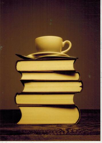Cup of coffee on a stack of books. Photo in old color image style.