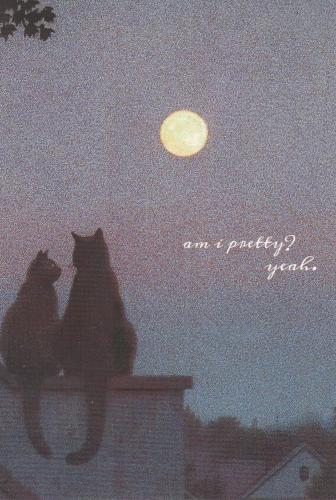 Two cats on the roof of a house in the moonlight.