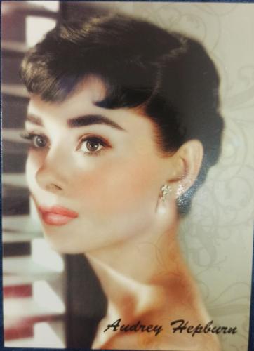 A postcard printed in New York shows a portrait of a young woman.