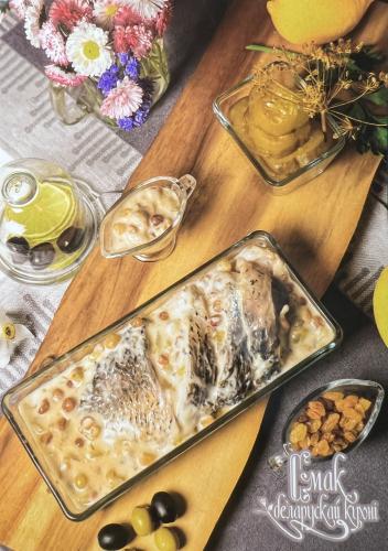 Baked mackerel with raisins in a glass jar