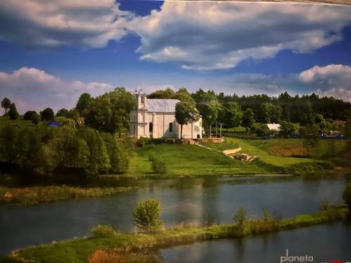 The house in the village on the river bank of the small village.