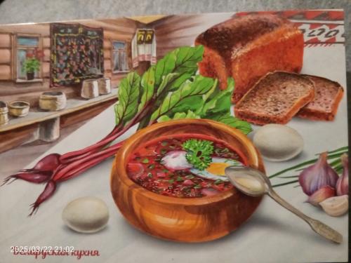 Ukrainian borscht with bread and vegetables on the table