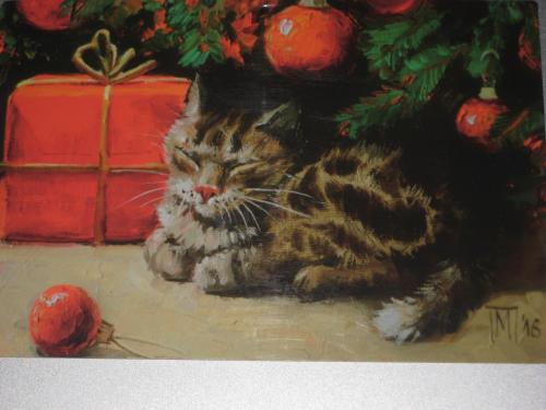 christmas card with a cat and christmas tree on the background
