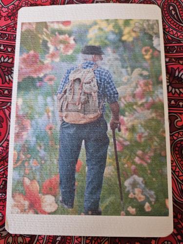 Fragment of a photo album with a picture of a man in a hat.