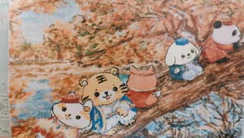Children's drawing on the fabric. Teddy bears on a tree branch