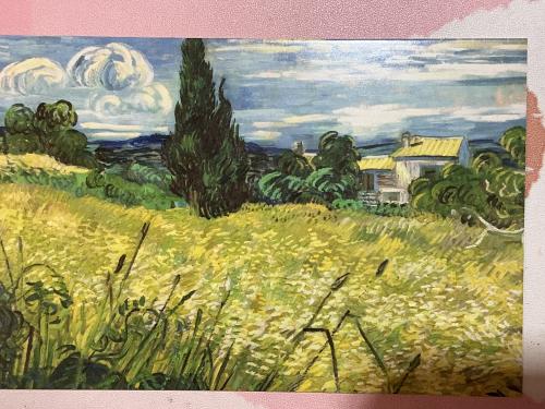 Painting of rural landscape with meadow, houses and clouds.