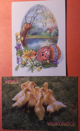 Easter egg with chicks on the background of a painted Easter egg