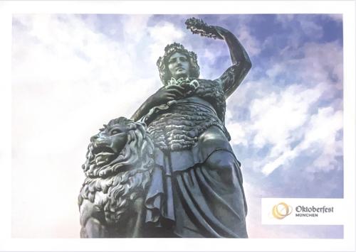 Statue of a lion and a lioness on the background of the sky