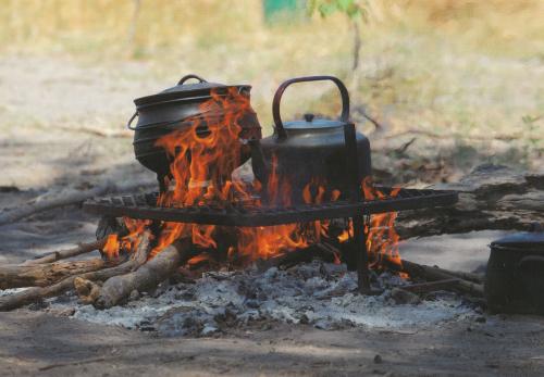 Cooking in a cauldron on a campfire. Picnic