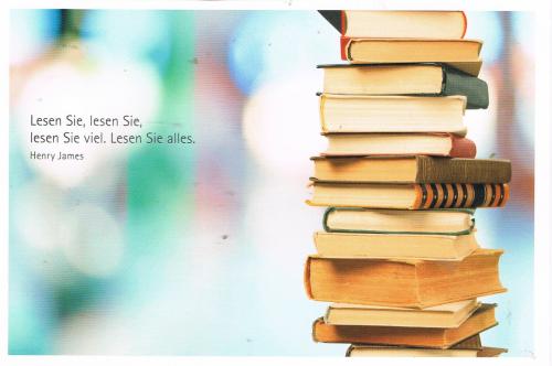 Old books on the background of the colorful bokeh. Photo in retro style.