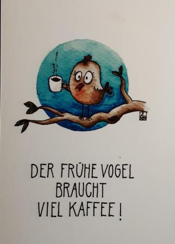 Drink coffee on a branch of a tree with a bird.