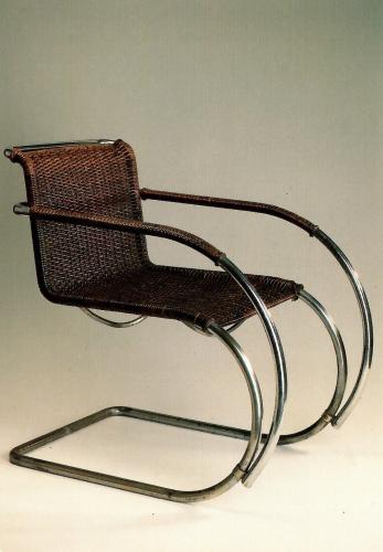 Wicker chair on a white background. The concept of comfort and warmth.
