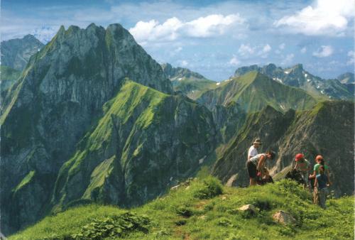 Climbers in the mountains on the background of the blue sky