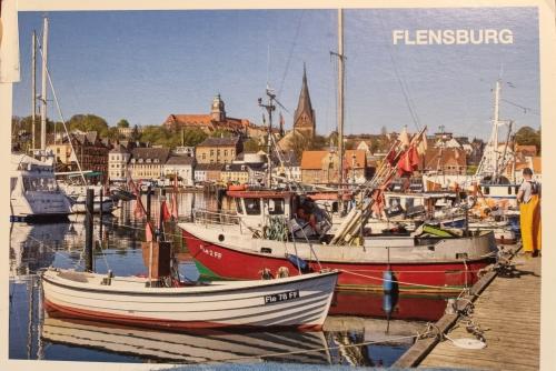 A postcard printed in Copenhagen shows fishing boats, circa 2010