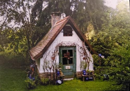Beautiful house in the garden. Photo in old color image style.