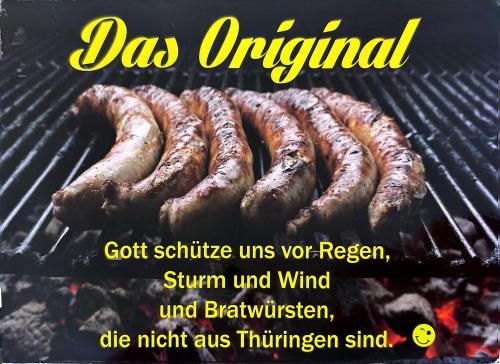 Barbecue with grilled sausages. Grilling sausages on a barbecue grill. Grilling sausages.