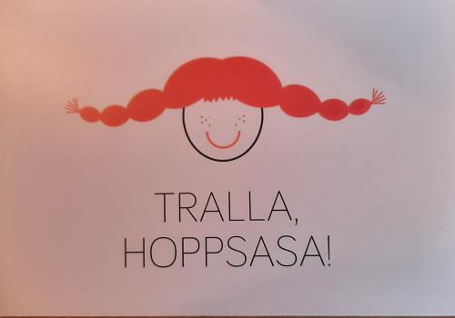 trallopas logo and text sign in shop window of fashion store