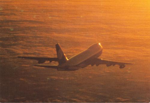 Airplane in the sea at sunset. Traveling by air.