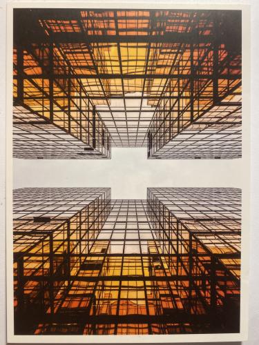 Abstract image of a skyscraper against the background of the sunset.