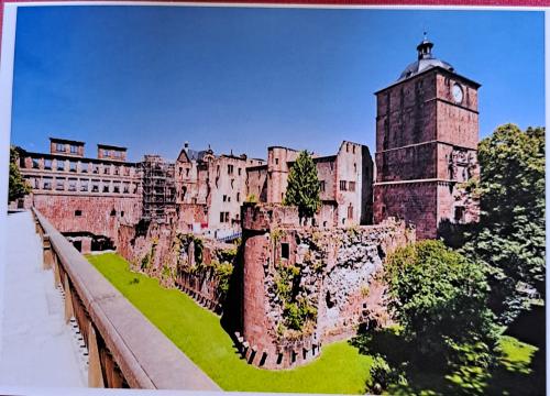 An old postcard printed in the UK shows Edinburgh Castle.