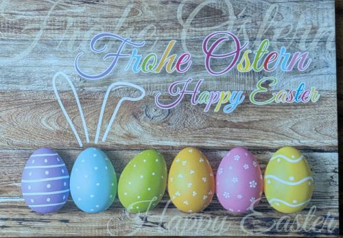 Easter eggs painted in pastel colors on rustic wooden background