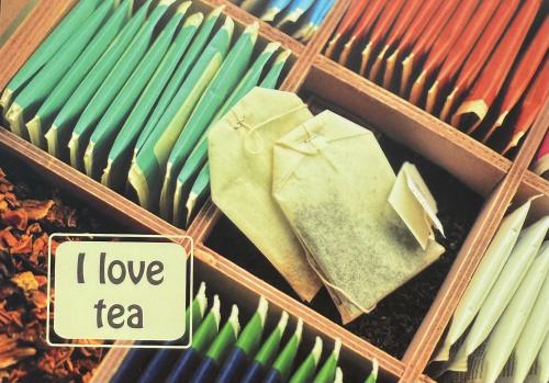 Colorful pencils in a wooden box with I love coffee text