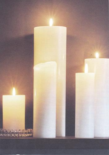 Burning candles on a dark background. Photo in old image style.