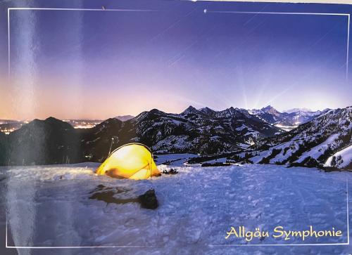 Camping in the mountains at sunset. The concept of travel and tourism.