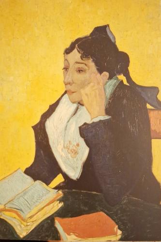 Antique oil painting of a woman reading a book on a bench
