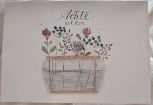Handmade greeting card with a bouquet of flowers in a vase