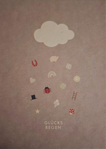 Greeting card with cloud and weather icons on paper background.