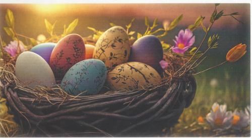 Easter eggs in a basket on a background of spring flowers.