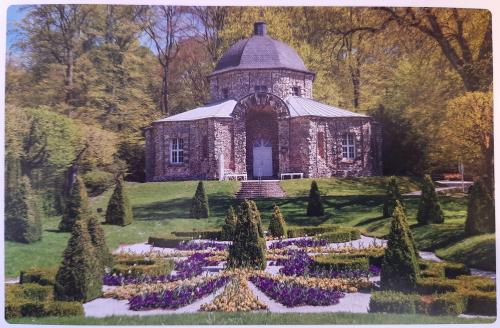 A postcard printed in Czechoslovakia shows a small chapel in the park, circa 1980s