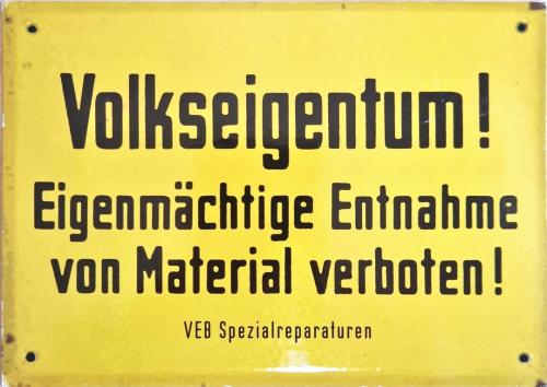 Vintage enameled sign with the german words Vollerschmarrn in german language