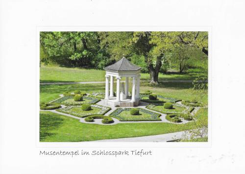 A postcard printed in the USA shows a gazebo in the park