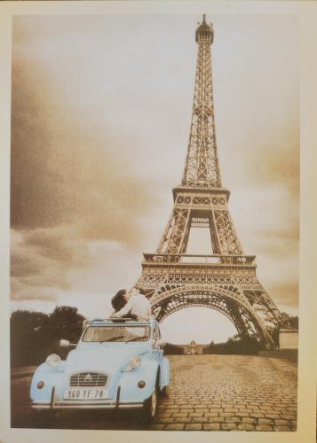 An antique photo shows the Eiffel Tower in Paris, France circa 1960s