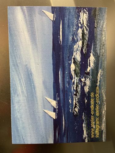 A fragment of an old book with a painting on the cover.