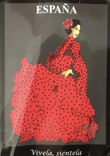 Espania, Sicily, Italy, 10/06/2019. Illustrative editorial. Red dress on a black background.
