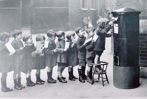 Crowd of school kids with books in their hands. Back to school.