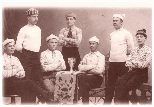 An antique photo shows a group of people