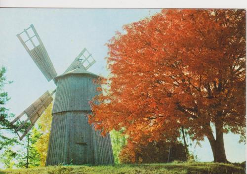 Autumn landscape with windmill and trees. Photo in old image style.