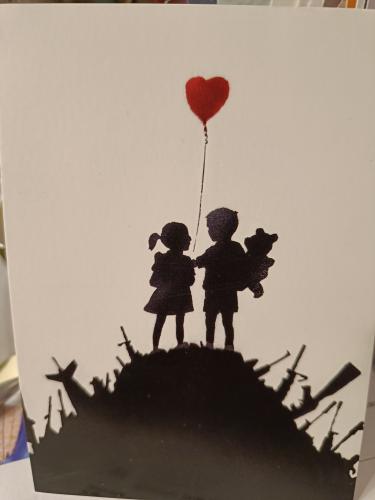 Silhouette of a girl and a boy with a red heart