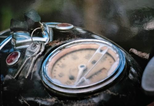 Detail of an old car with a key on the steering wheel