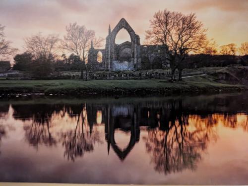 A view of the ruins of St Mary's Abbey at sunset.