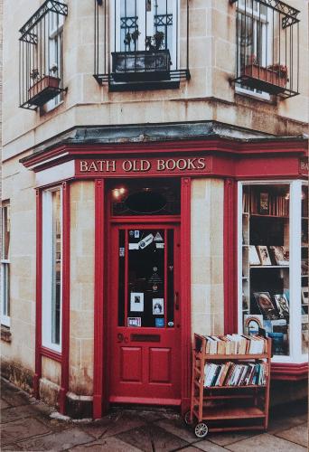 A red front door of a book shop in Oxford Street.