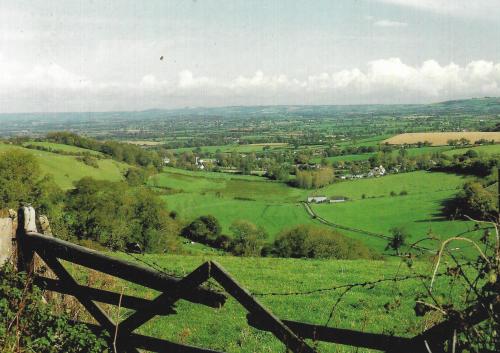 A view of the English countryside from the top of a hill.