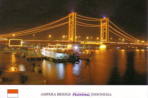 A postcard printed in Amsterdam shows a view of the bridge and the city