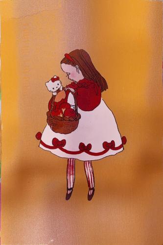 A little girl in a red dress with a cat in her arms
