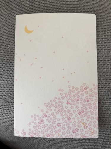 Handmade postcard with the moon and stars on a gray background